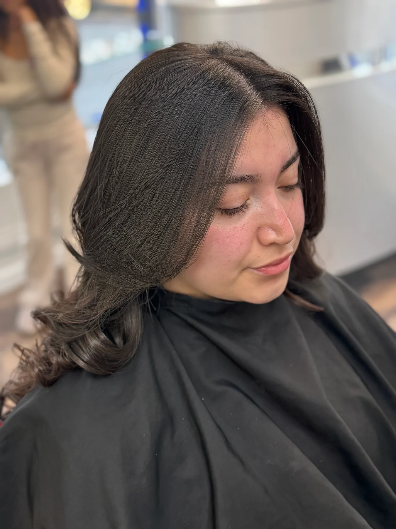 Face-framing layers and soft curls styled at Ponte Bella