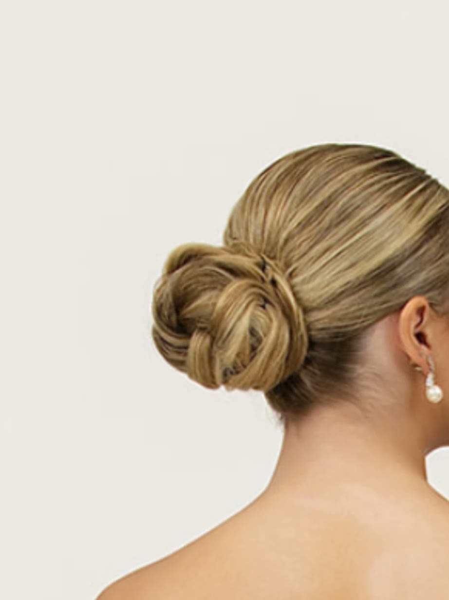 Classic twisted low bun wedding style